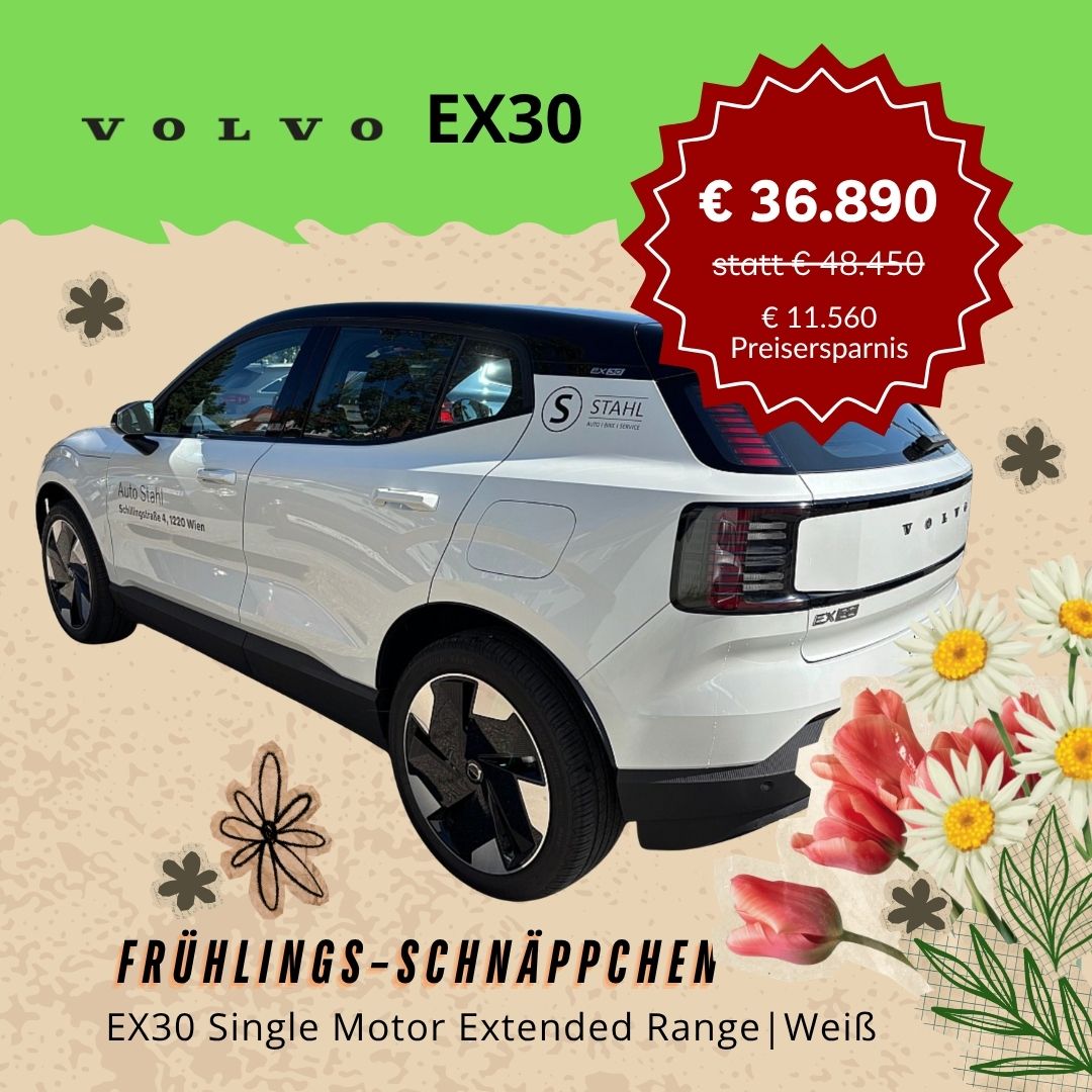 Weißes Auto mit Blumen und Text